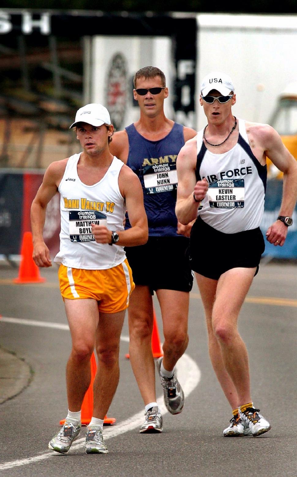 Free Image of Three Men Running in a Marathon 