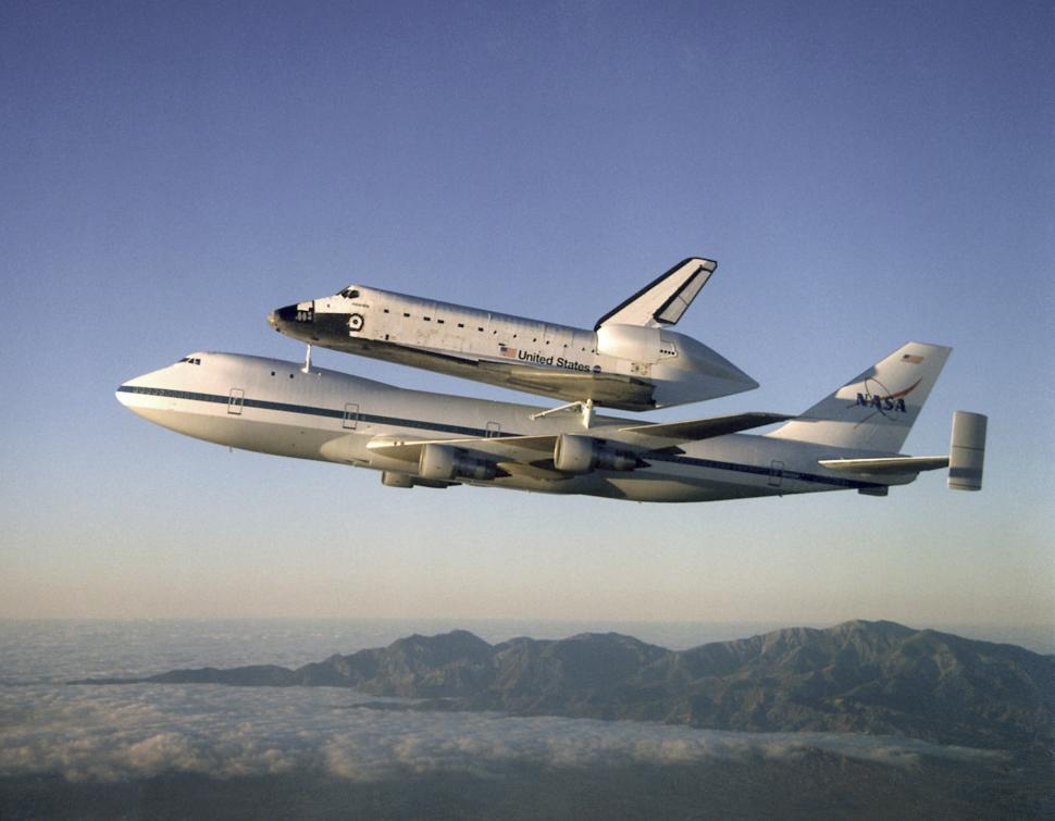 Free Image of Large Jetliner Carrying Space Shuttle on Its Back 