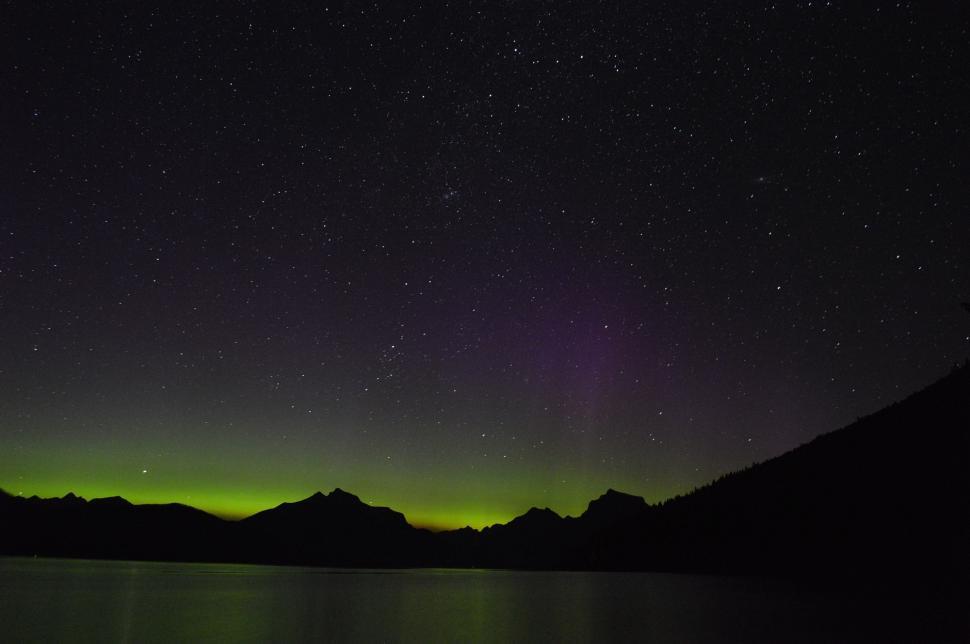 Free Image of Green and Black Aurora Over a Mountain Range 