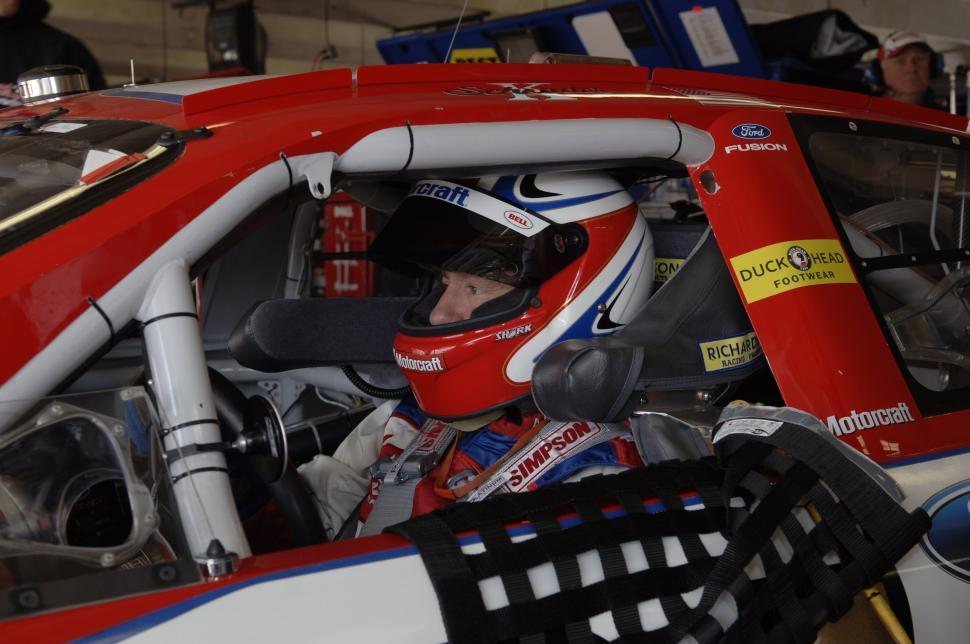 Free Image of Man Sitting in Racing Car in Garage 