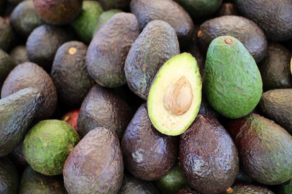 Free Image of A Pile of Avocados Sitting Next to Each Other 