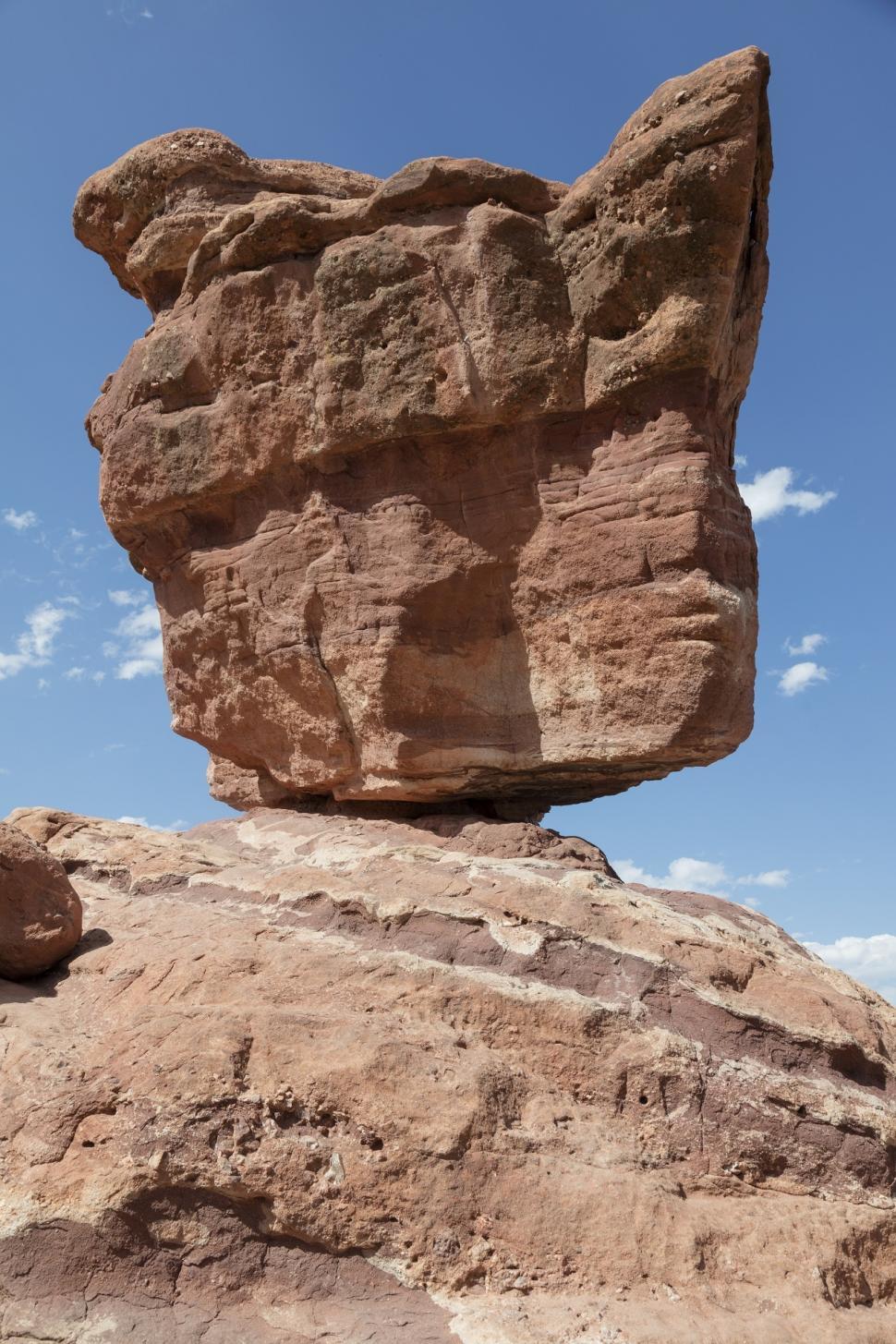Free Image of A Rock Formation Rising Amid Desert Landscape 