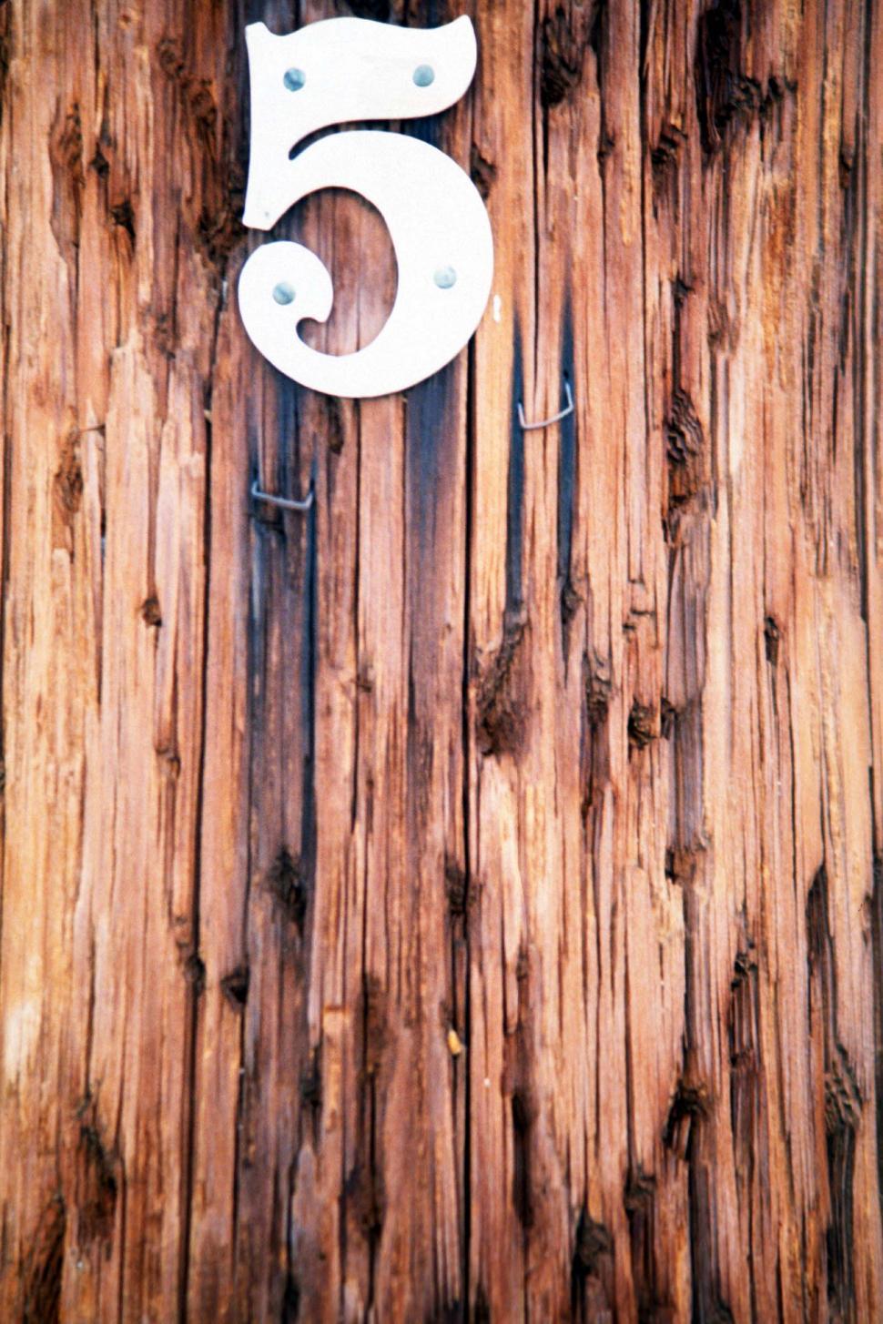 Free Image of numbers five telephone pole staples holes worn weathered texture grain wooden 