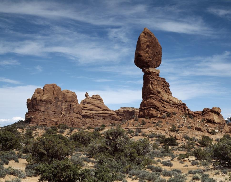 Free Image of Rock Formation Rising From Desert Landscape 