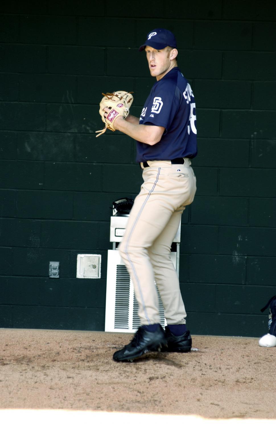 Free Image of Man in Baseball Uniform Holding Catchers Mitt 