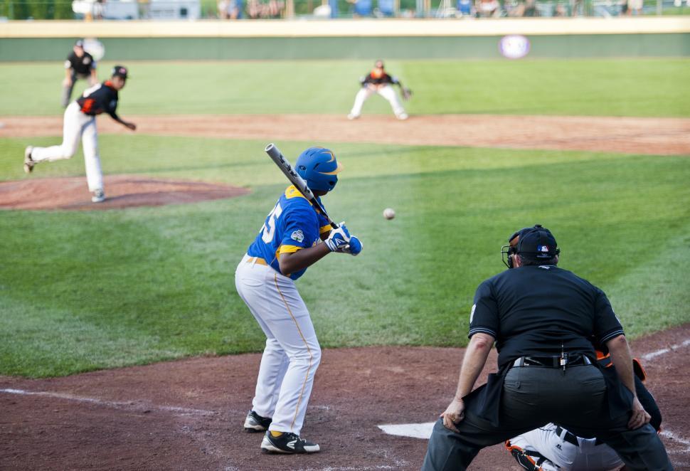 Free Image of Baseball Player Holding Bat on Field 