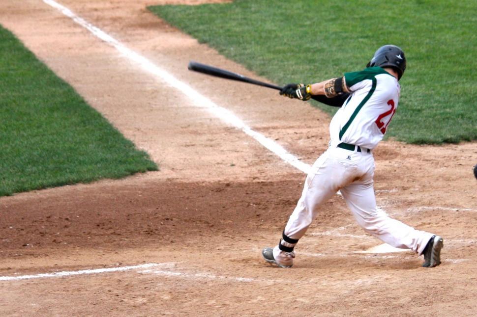 Free Image of Baseball Player Swinging Bat at Ball 