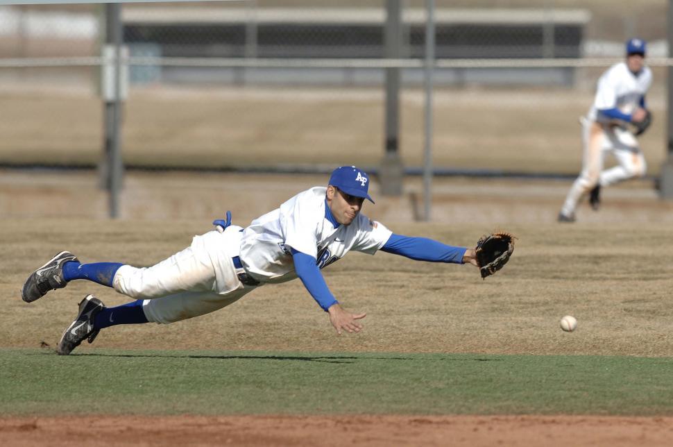 Free Image of Baseball Player Diving to Catch a Ball 