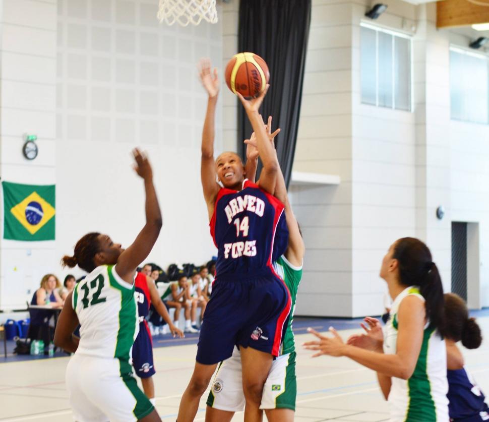 Free Image of Young Women Playing a Game of Basketball 