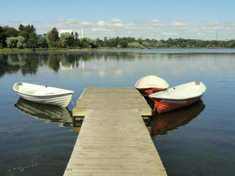 Free Image of Three Boats Docked at the End of a Dock 