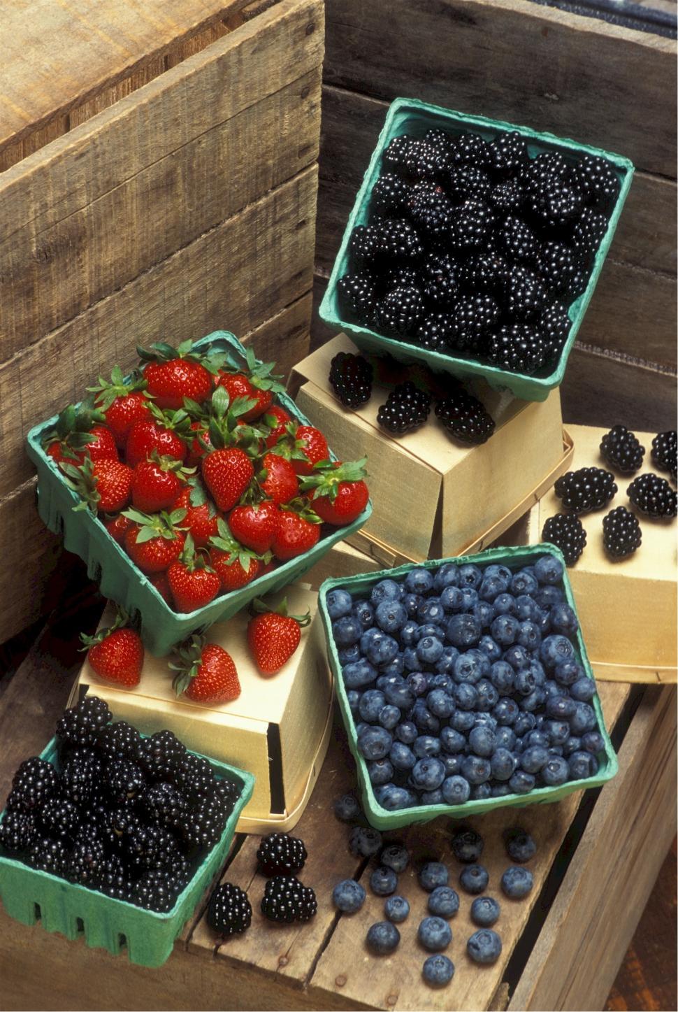 Free Image of A Pile of Boxes Filled With Different Types of Fruit 