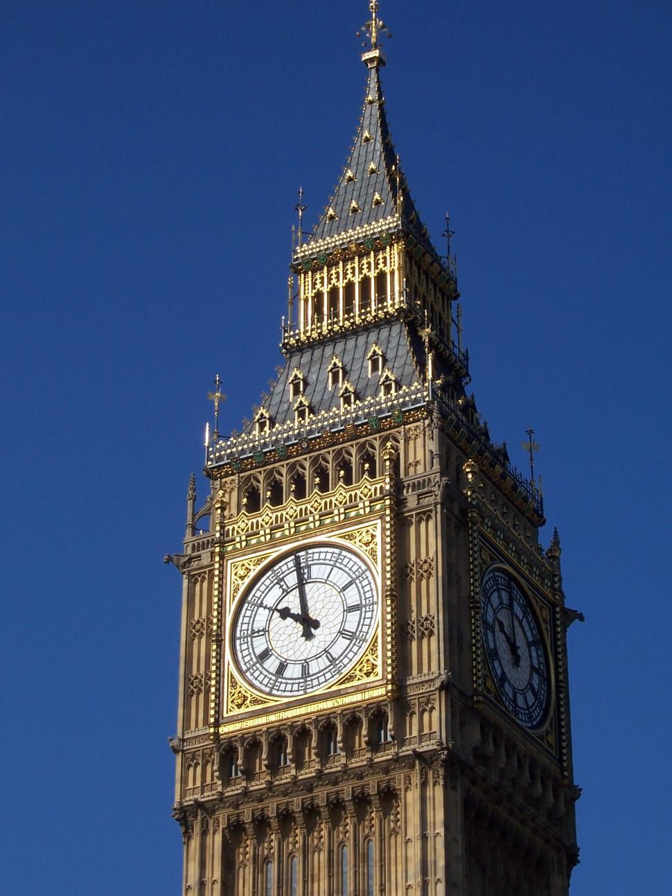 Free Image of Tall Clock Tower With Four Clocks 