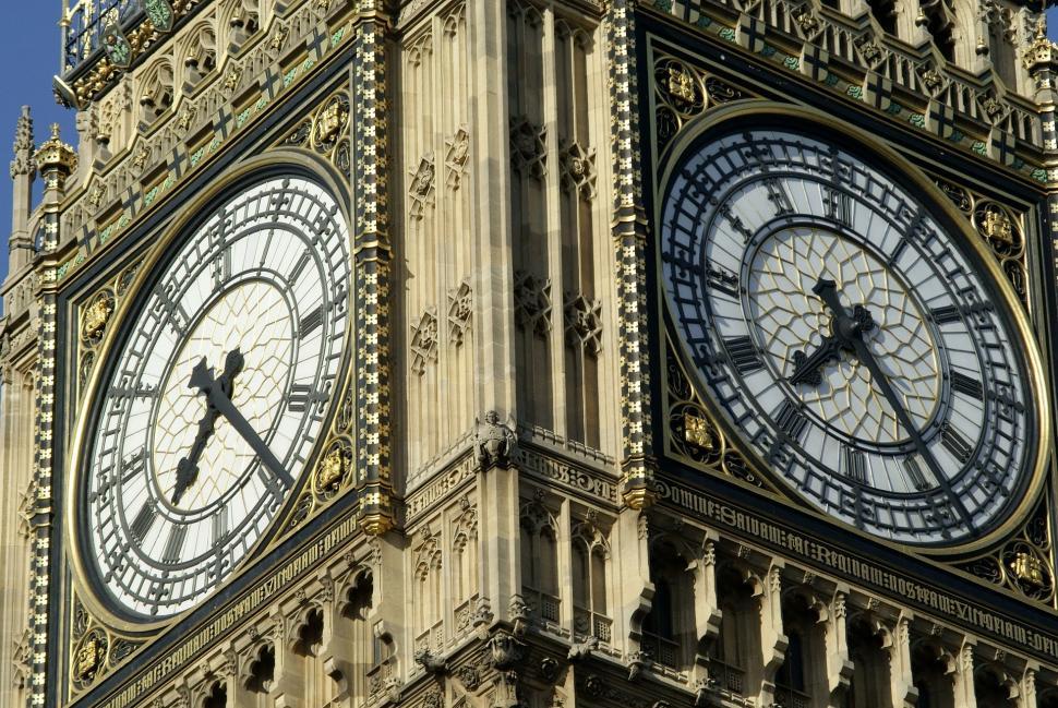 Free Image of Grand Clock Tower With Four Clock Faces 