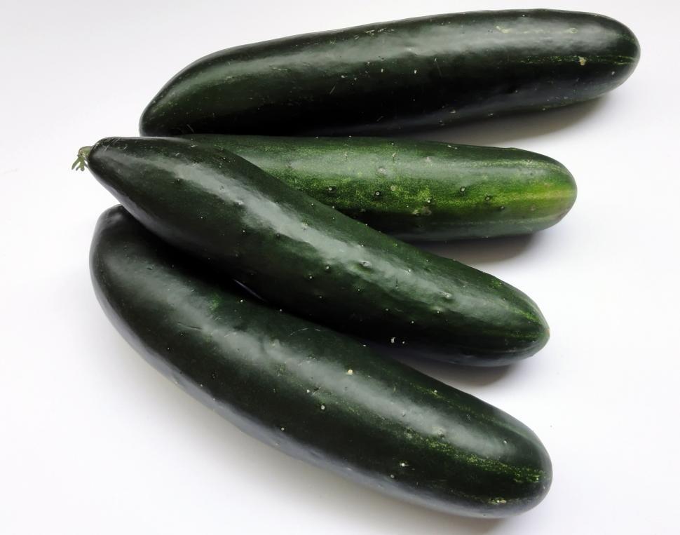 Free Image of Group of Cucumbers on White Table 
