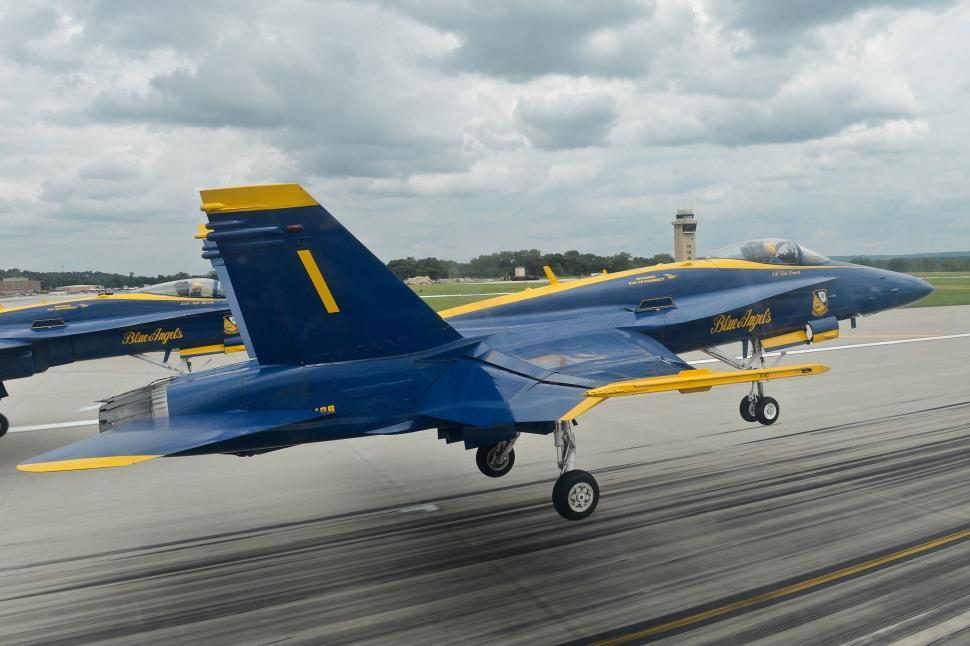 Free Image of Blue and Yellow Planes on a Runway 
