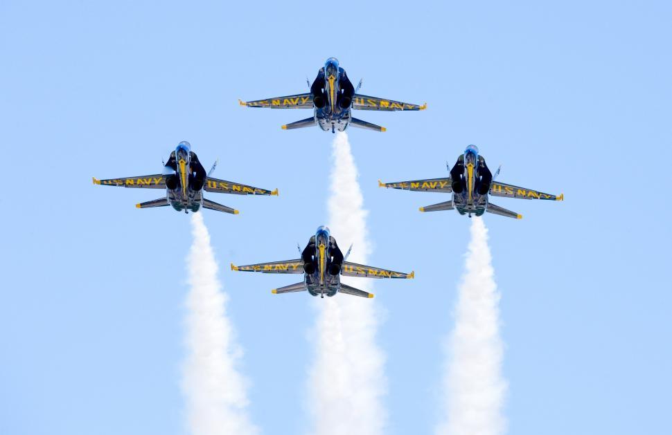 Free Image of Group of Fighter Jets Flying Through Blue Sky 