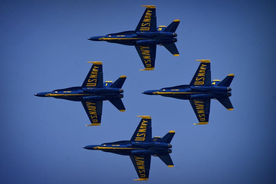 Free Image of Four Blue Fighter Jets Flying in Formation 