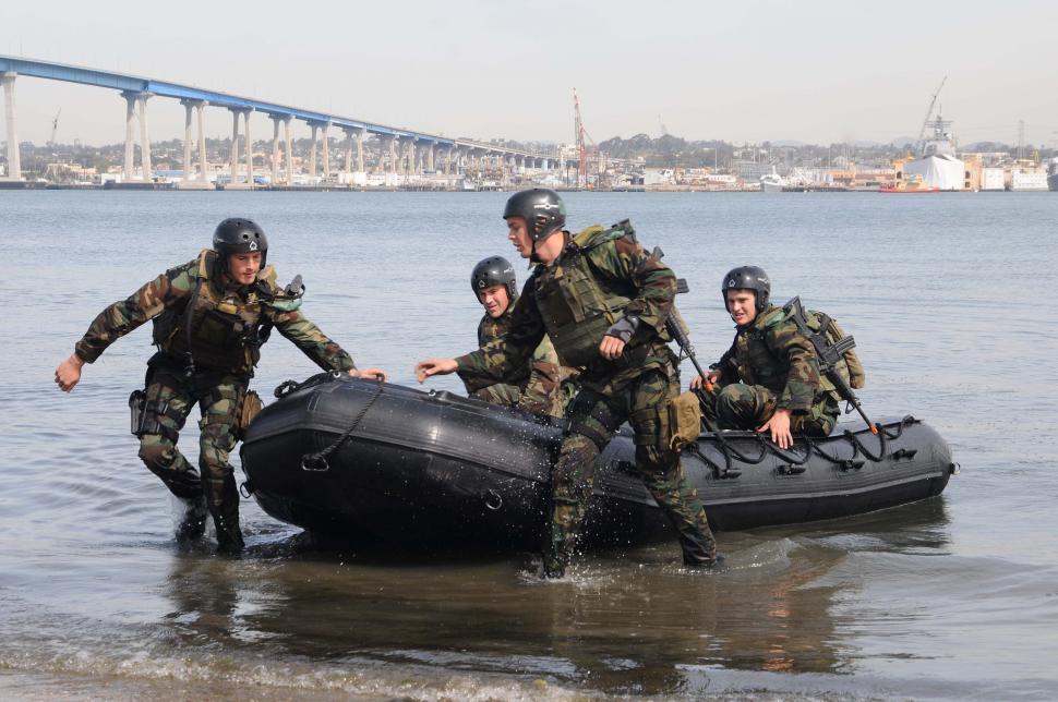 Free Image of Soldiers Pushing Raft Out of Water 