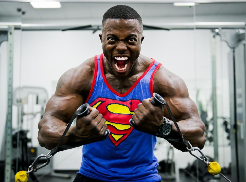Free Image of Man in Blue Tank Top With Superman Logo 