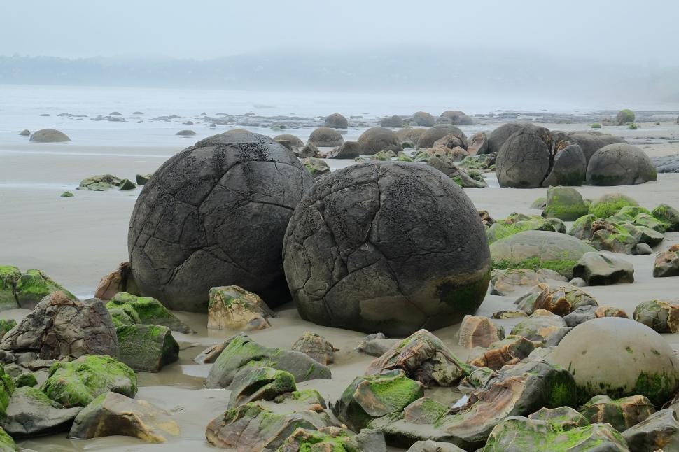 Free Image of Large Rocks on Sandy Beach 