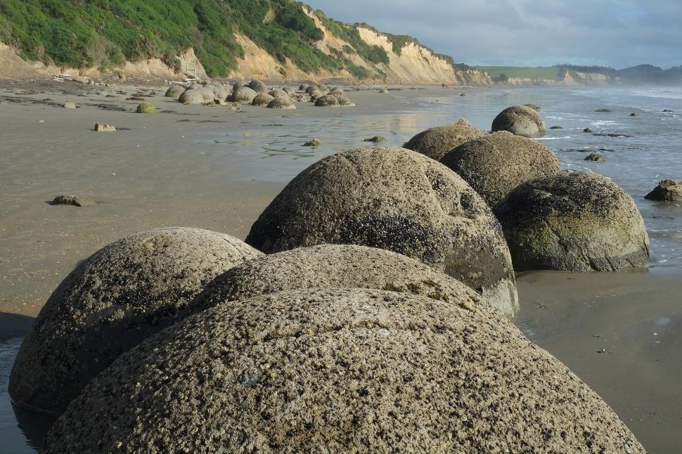 Free Image of Group of Rocks on Sandy Beach 