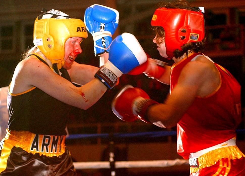 Free Image of Two People Sparring in a Boxing Ring 