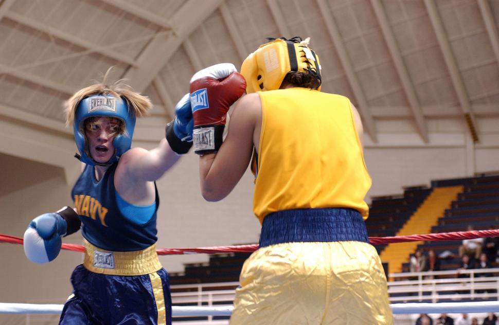 Free Image of Two People in a Boxing Ring With Gloves On 