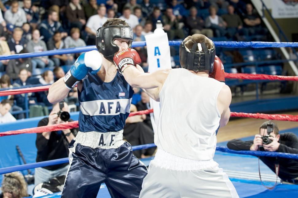 Free Image of Two Men Standing in a Boxing Ring 