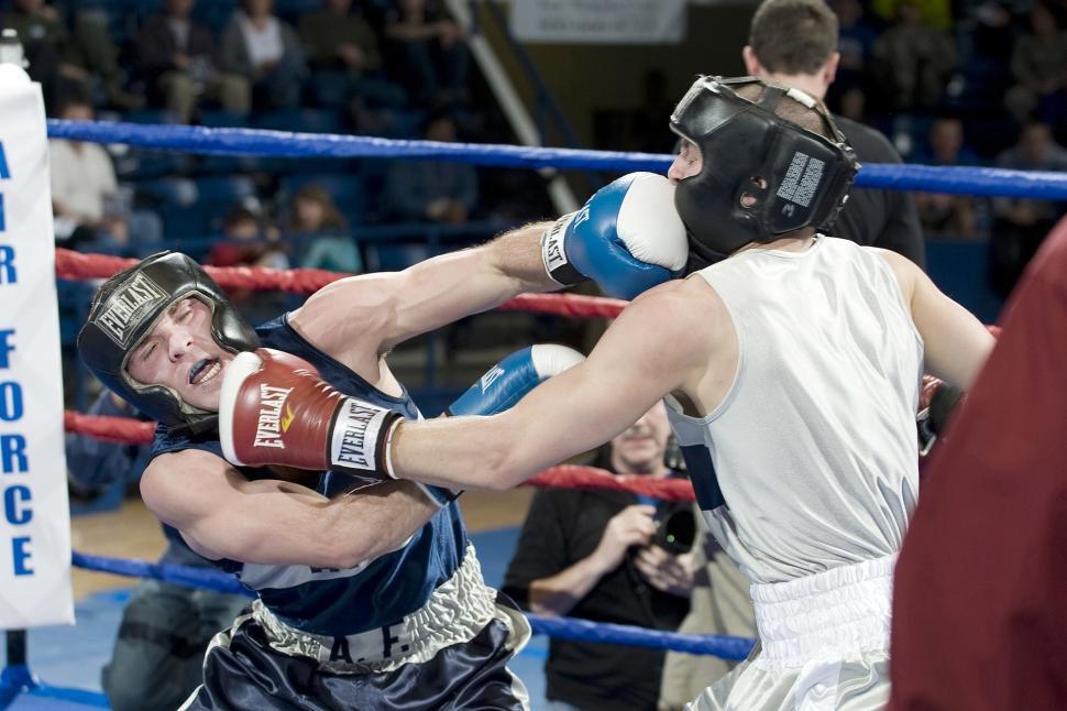 Free Image of Two Men Fighting in a Boxing Ring 