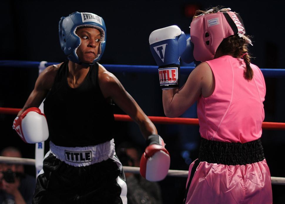 Free Image of Two Women Standing in Boxing Ring 