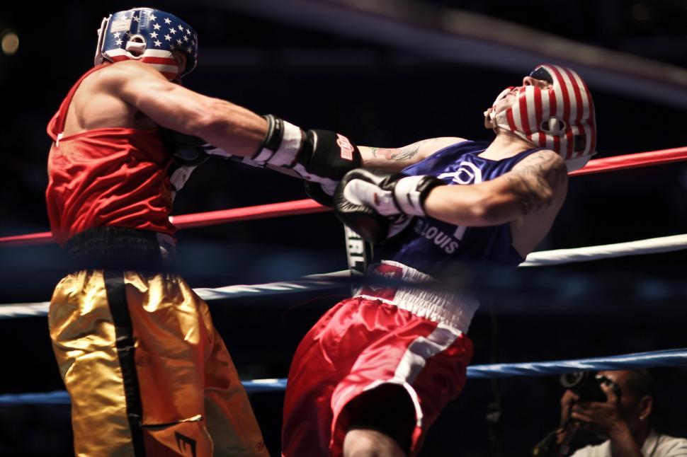 Free Image of Two Men Fighting in a Boxing Ring 