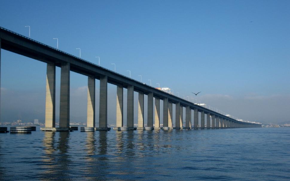 Free Image of Long Bridge Spanning Body of Water 