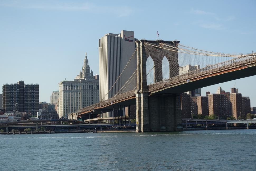Free Image of Large Bridge Spanning Across Vast Water 