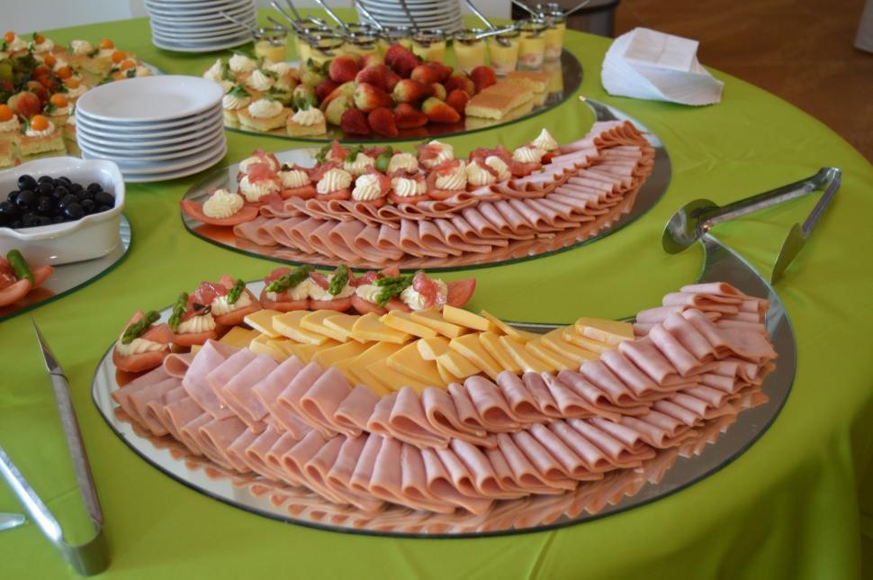 Free Image of Green Table With Plates of Food 