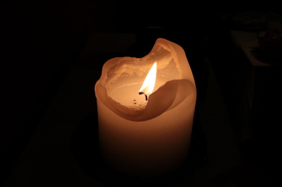 Free Image of Illuminated Candle in Dark Environment 