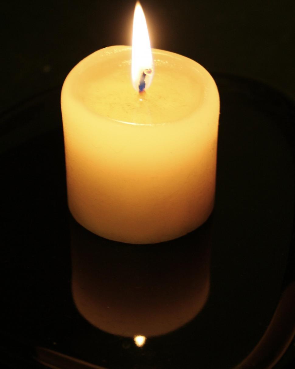 Free Image of Lit Candle on Table 