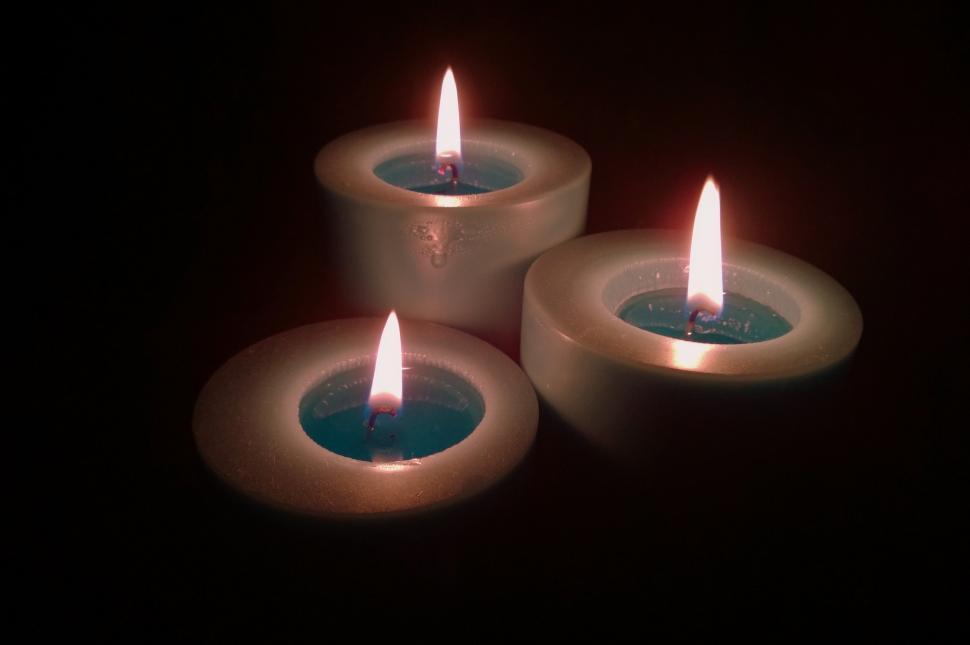 Free Image of Three Lit Candles on Table 