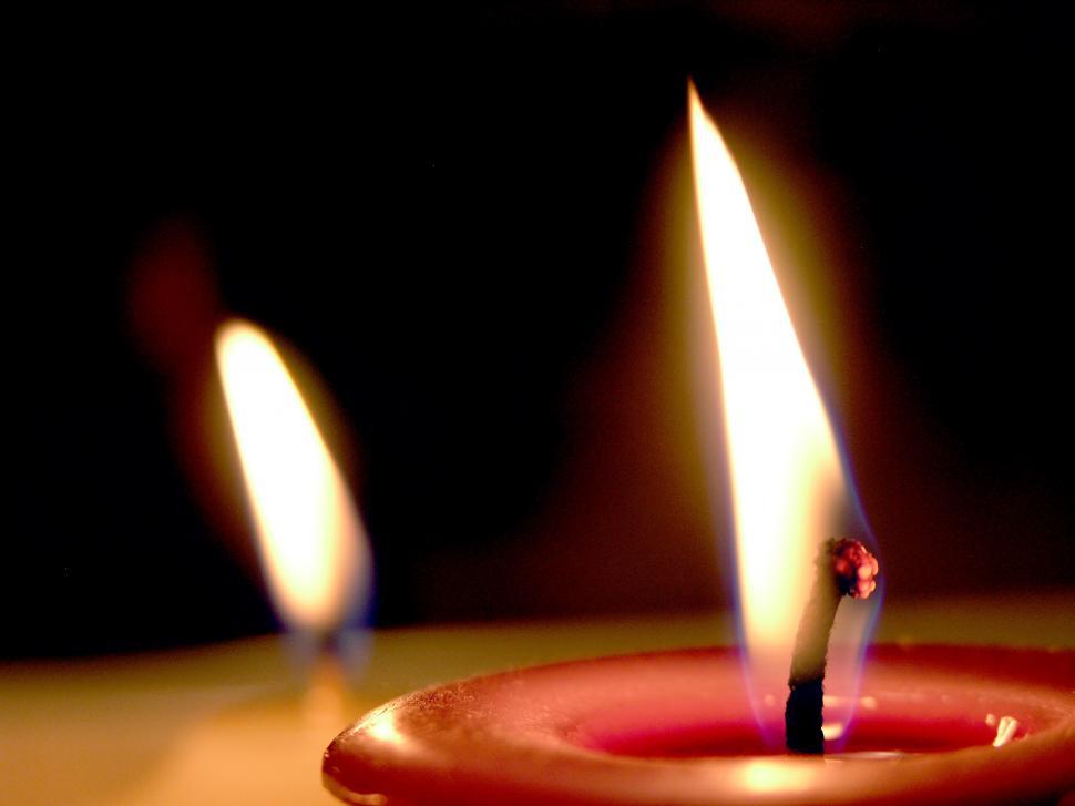 Free Image of Three Lit Candles on a Table 