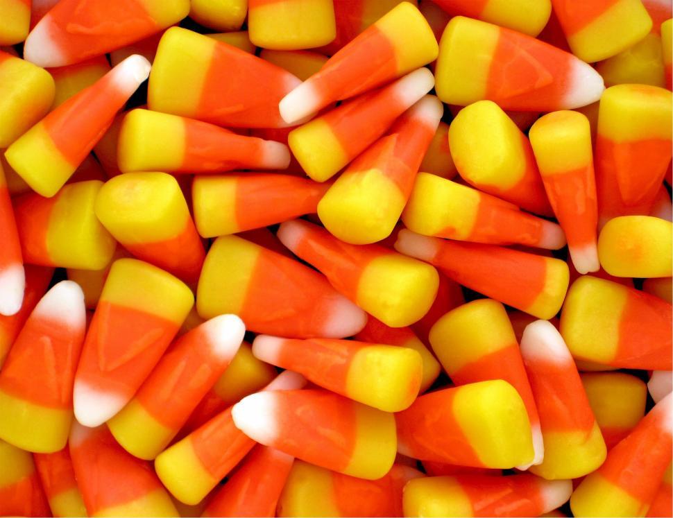 Free Image of Pile of Candy Corn With Orange and Yellow Stripes 