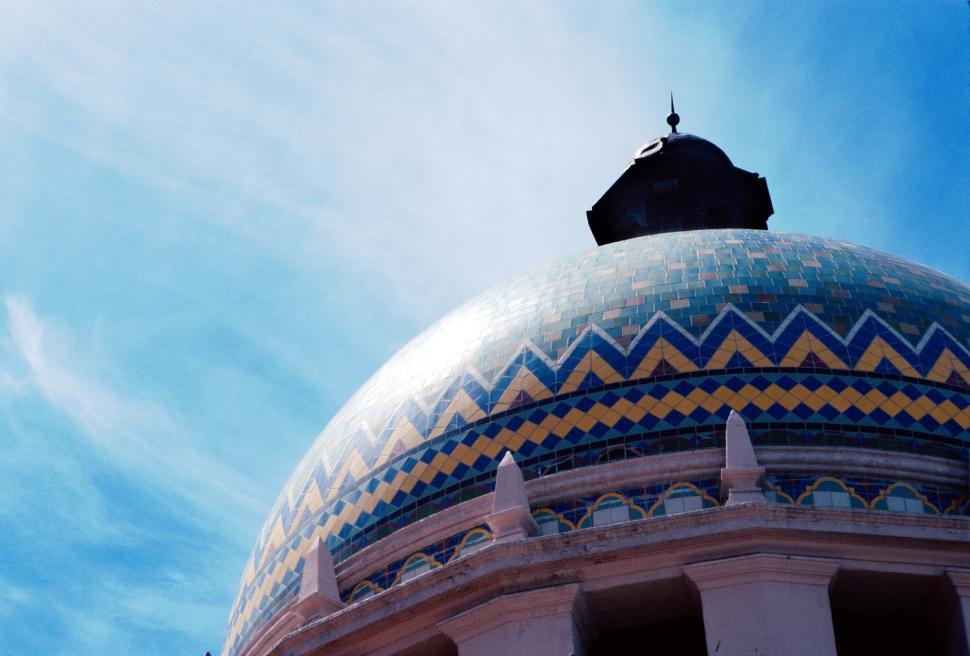 Free Image of Dome Atop Building Against Blue Sky 