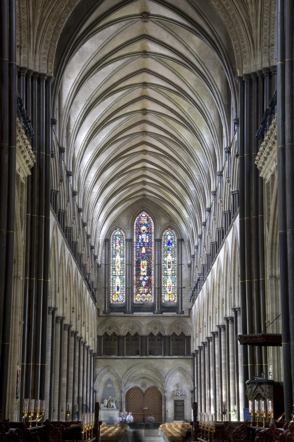 Free Image of Inside of a Cathedral With Pews and Stained Glass Windows 