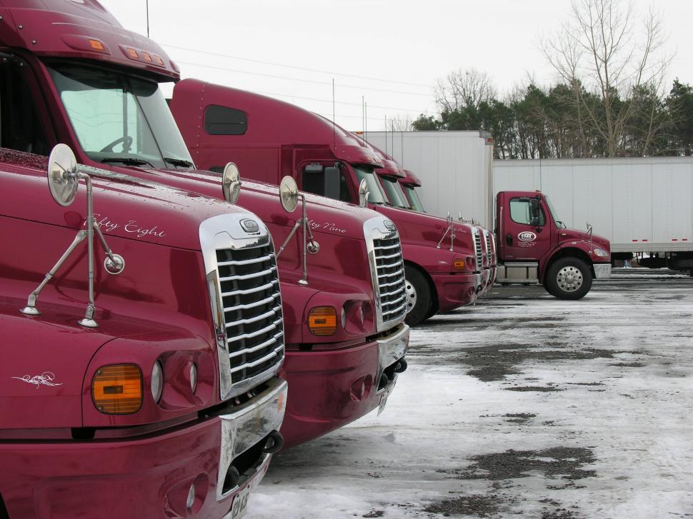 Free Image of Red Freightliner trucks 