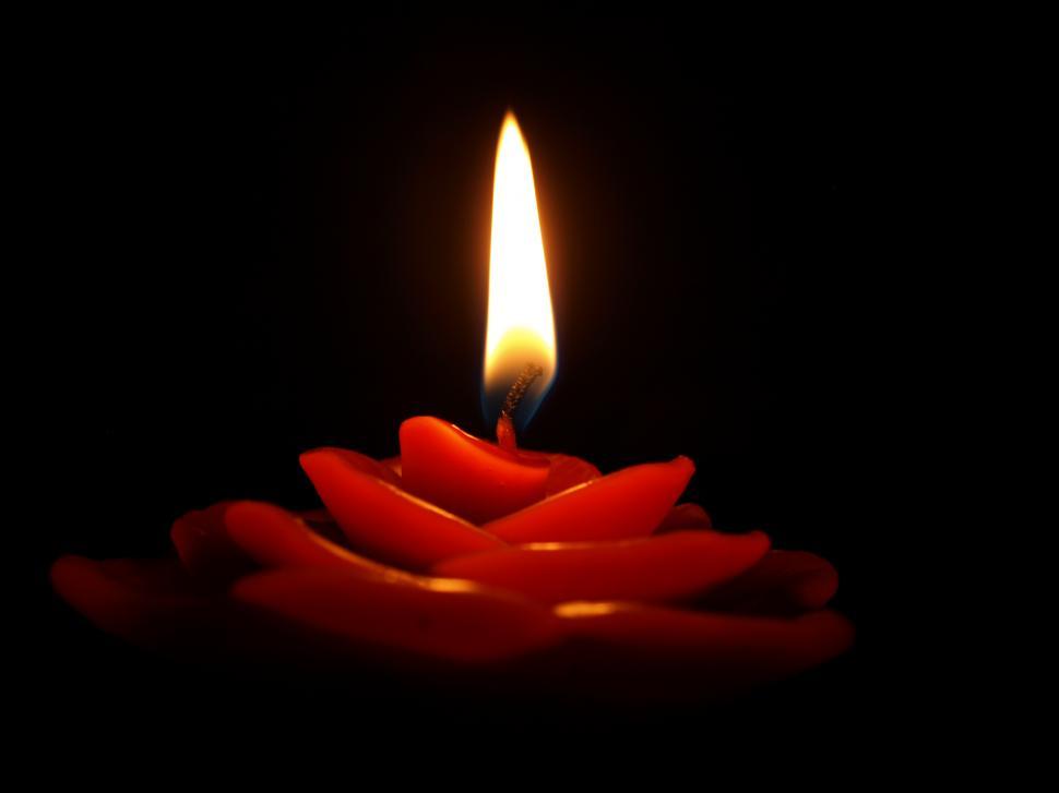Free Image of Red Candle Burning in Black Background 