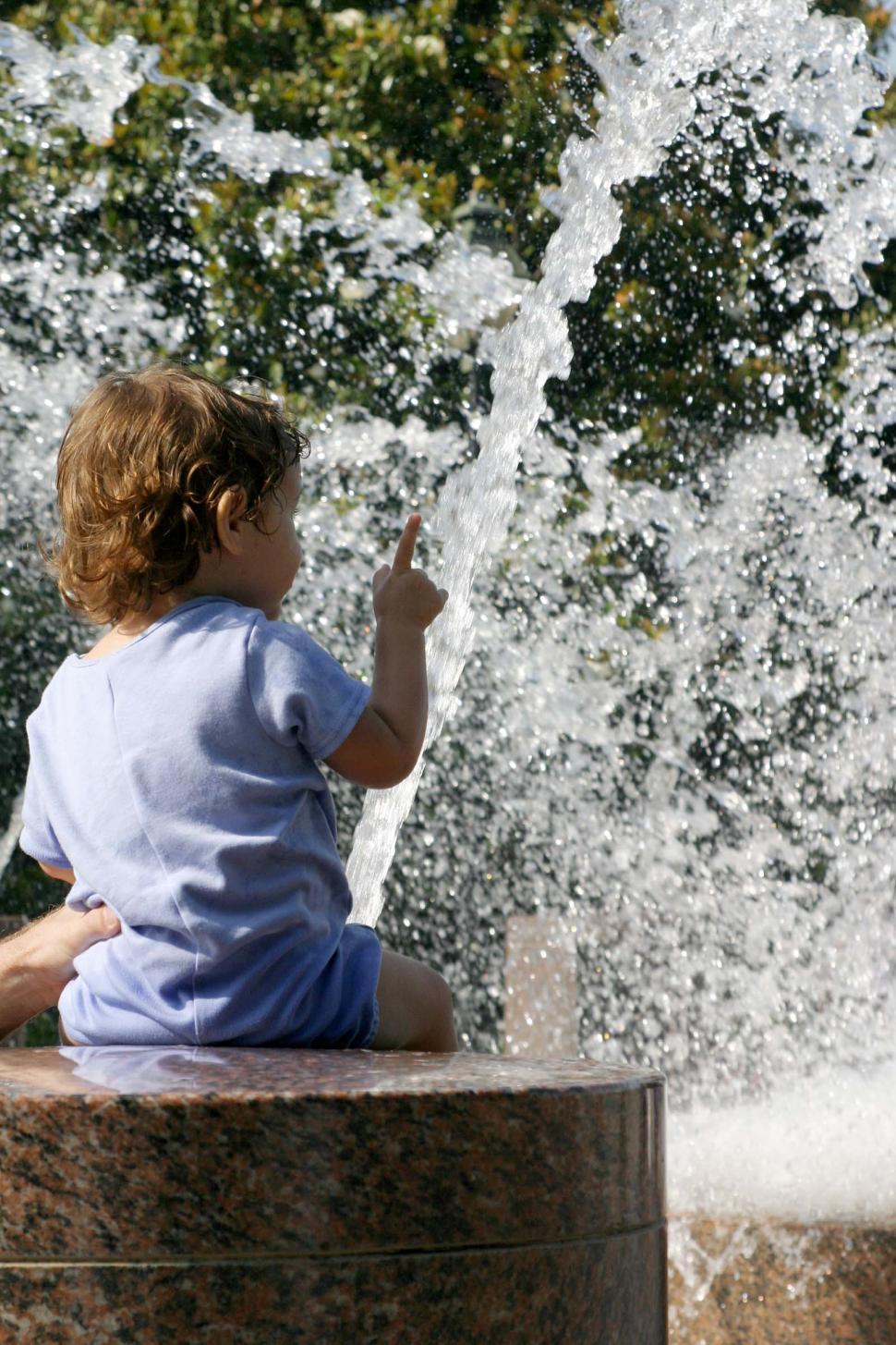 Free Image of Child on a fountain 