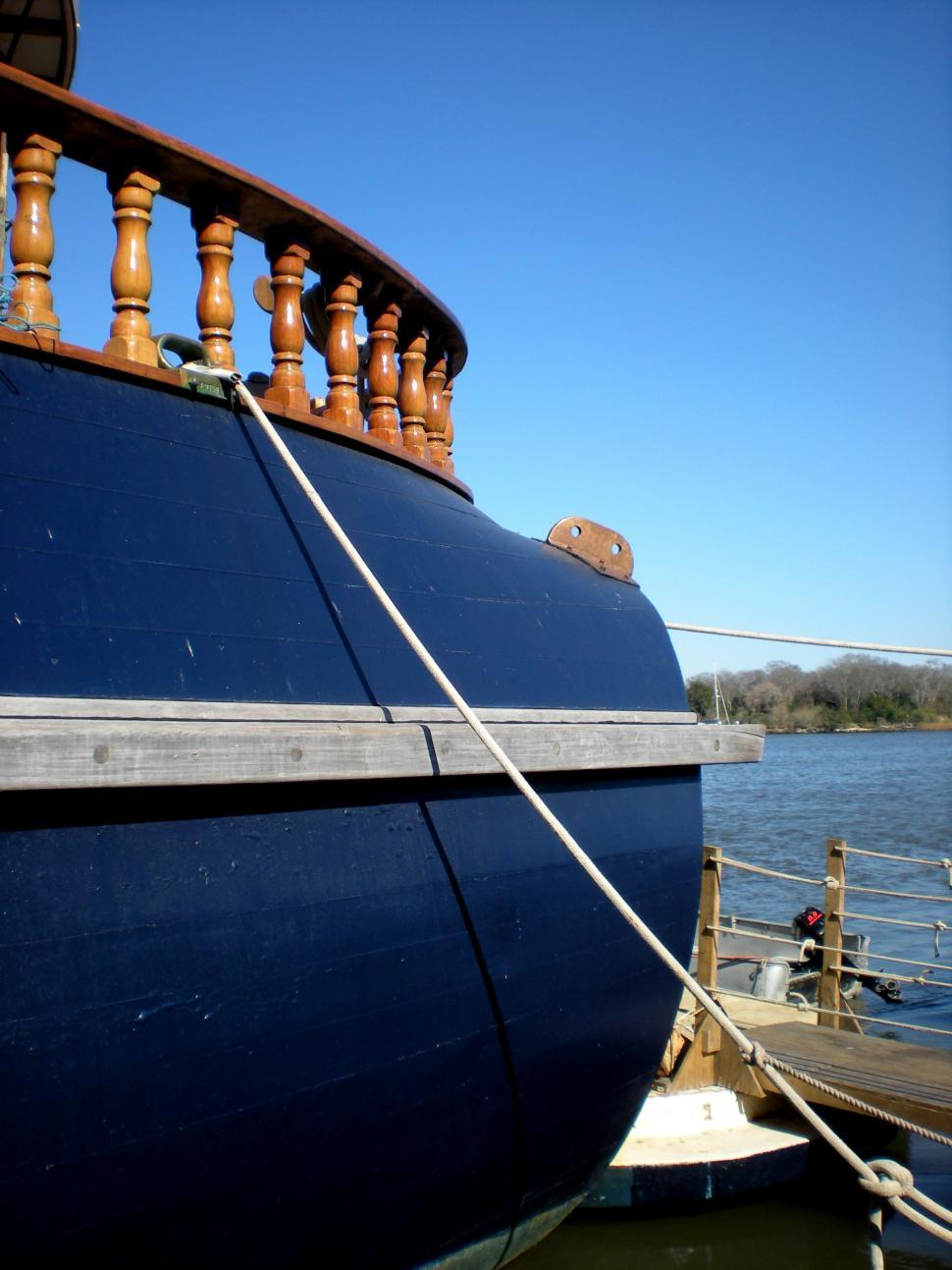 Free Image of Large Blue Boat Tied Up to Dock 