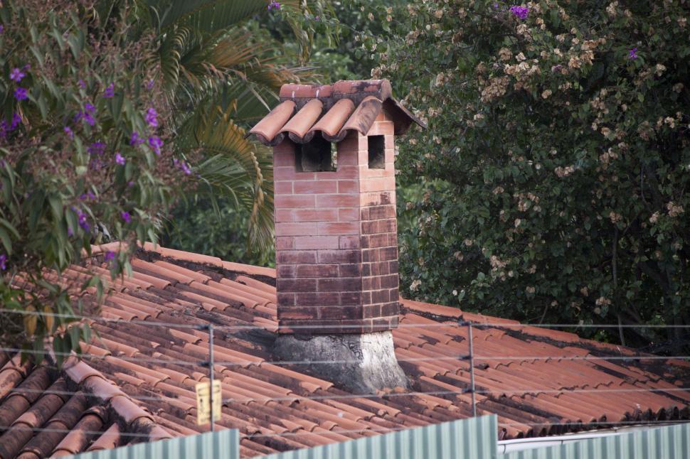 Free Image of Brick Chimney on Top of Tiled Roof 