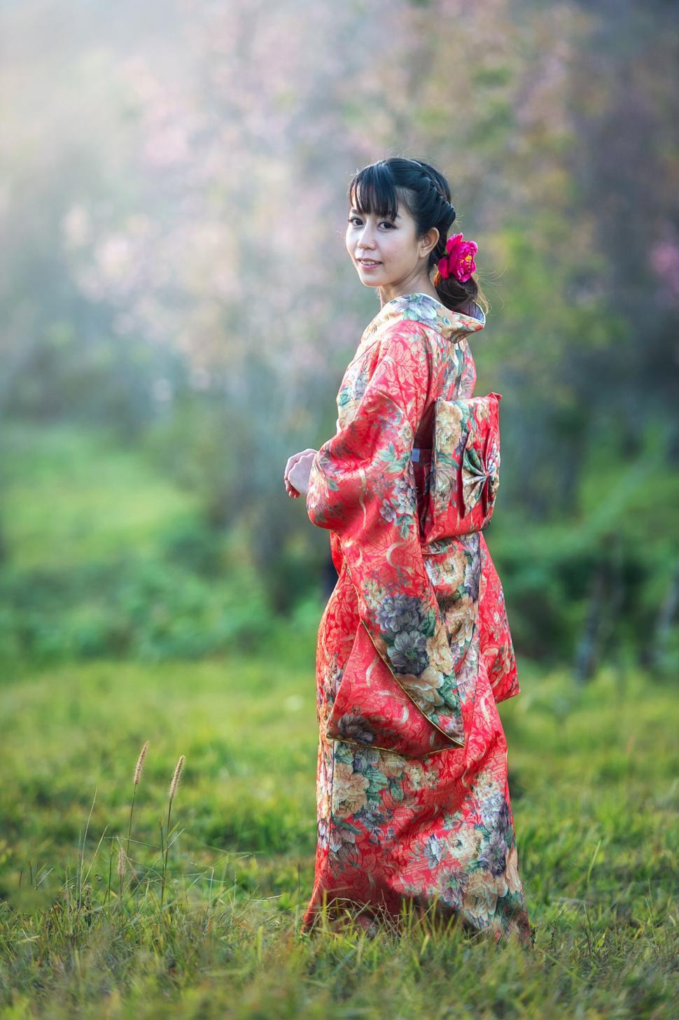 Free Image of Woman in Kimono Standing in Field 