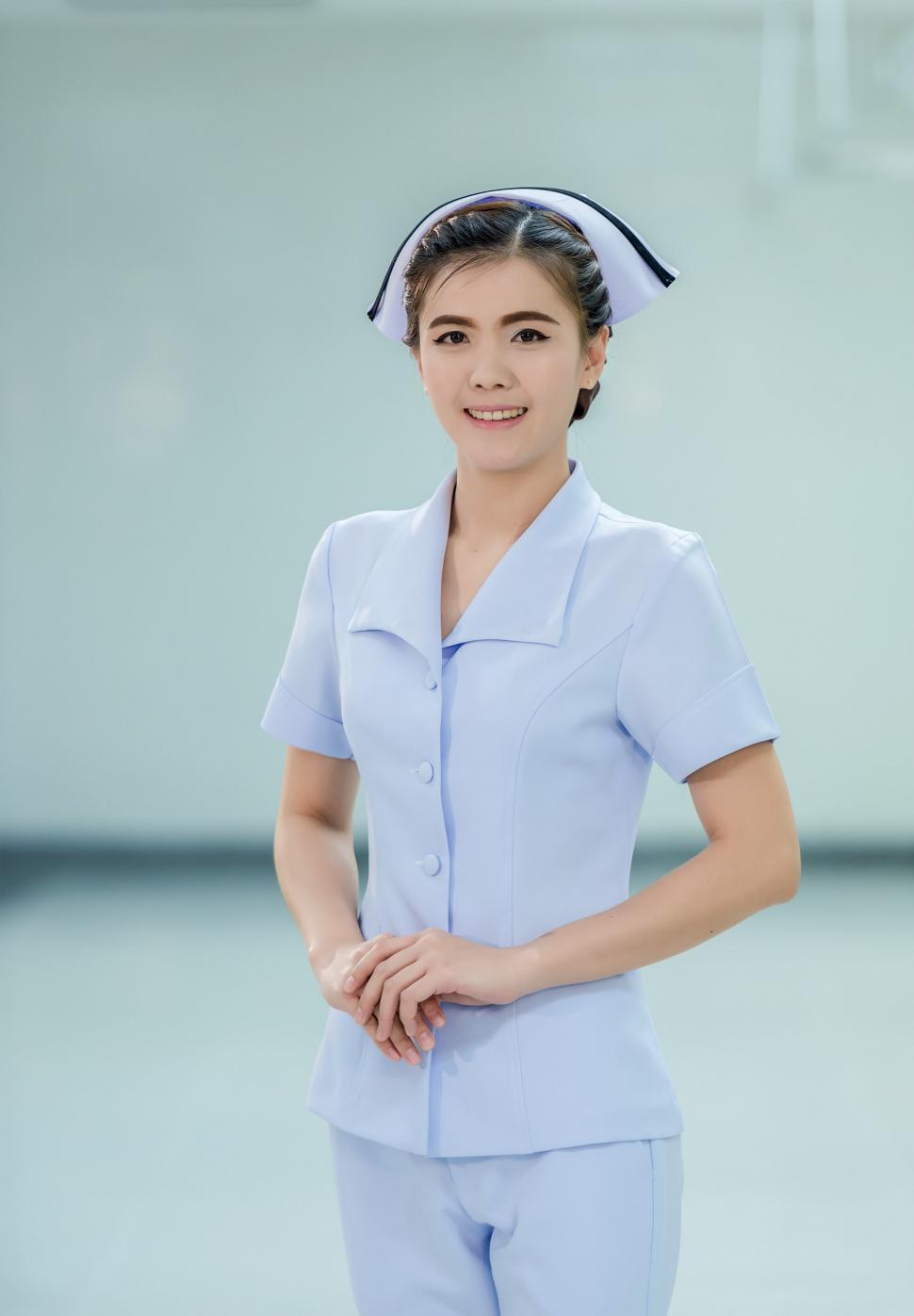 Free Image of Woman in Nurse Uniform Posing for Picture 