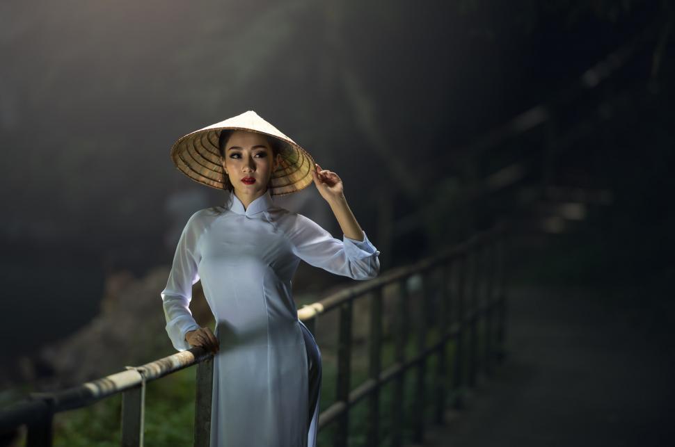 Free Image of Woman in White Dress and Hat 