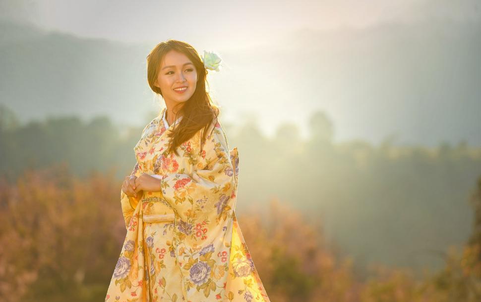 Free Image of Woman in a Kimono Standing in a Field 